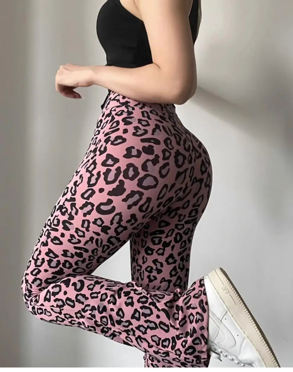 Leopard print yoga pants are breathable and make legs look longer. Slightly flared pants. High-waisted sports Pilates pants.