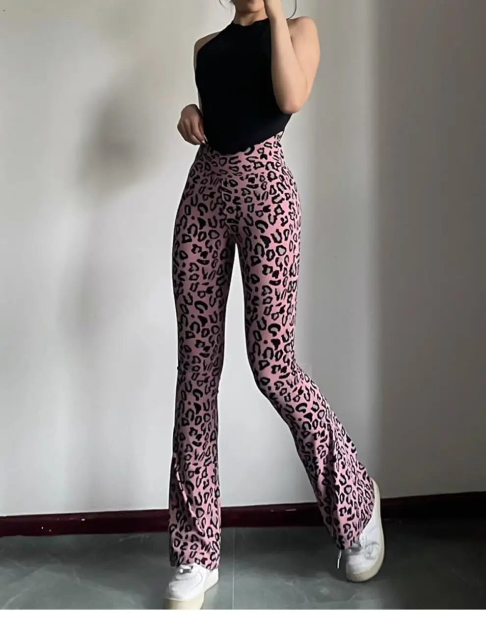 Leopard print yoga pants are breathable and make legs look longer. Slightly flared pants. High-waisted sports Pilates pants.
