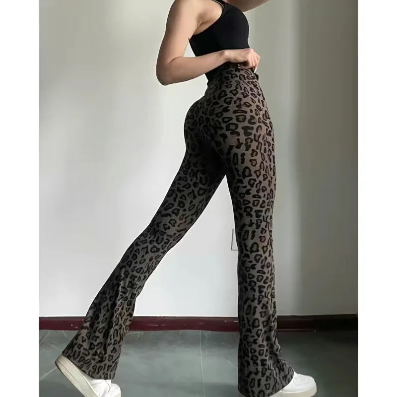 Leopard print yoga pants are breathable and make legs look longer. Slightly flared pants. High-waisted sports Pilates pants.