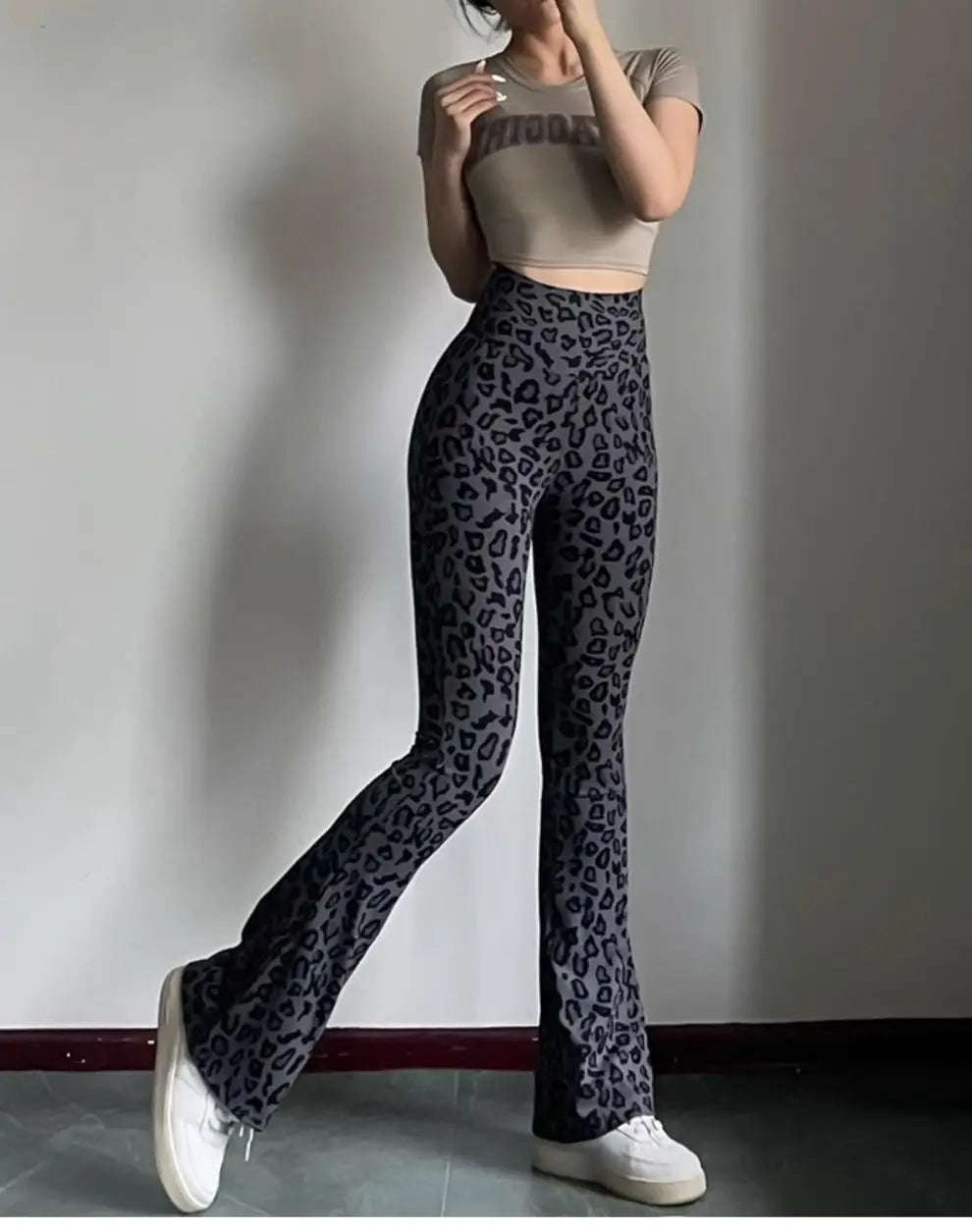 Leopard print yoga pants are breathable and make legs look longer. Slightly flared pants. High-waisted sports Pilates pants.