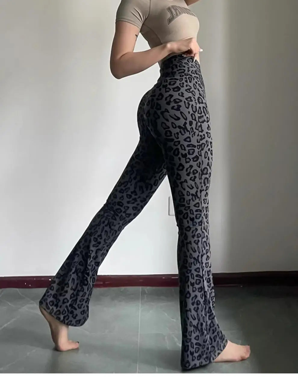 Leopard print yoga pants are breathable and make legs look longer. Slightly flared pants. High-waisted sports Pilates pants.