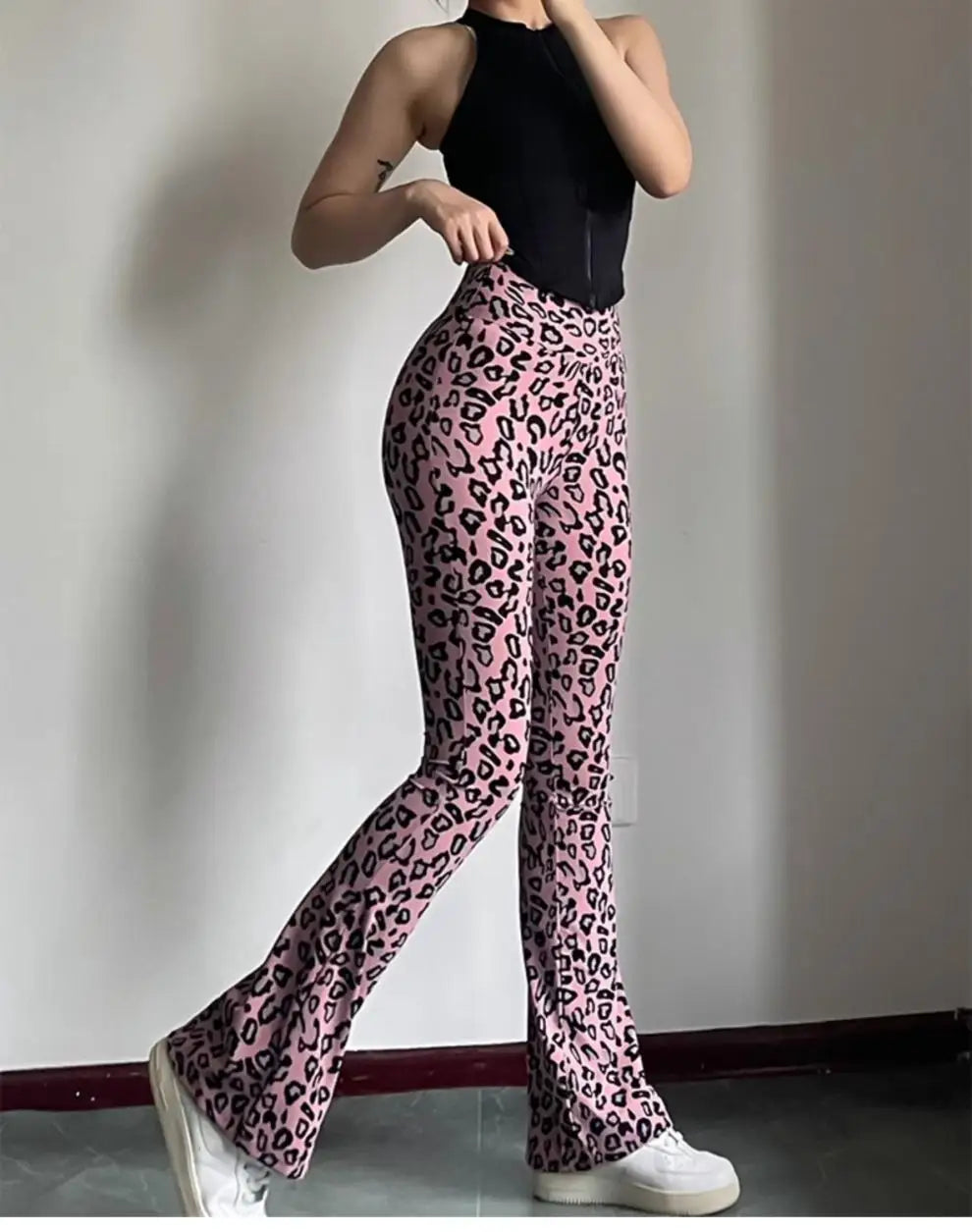 Leopard print yoga pants are breathable and make legs look longer. Slightly flared pants. High-waisted sports Pilates pants.