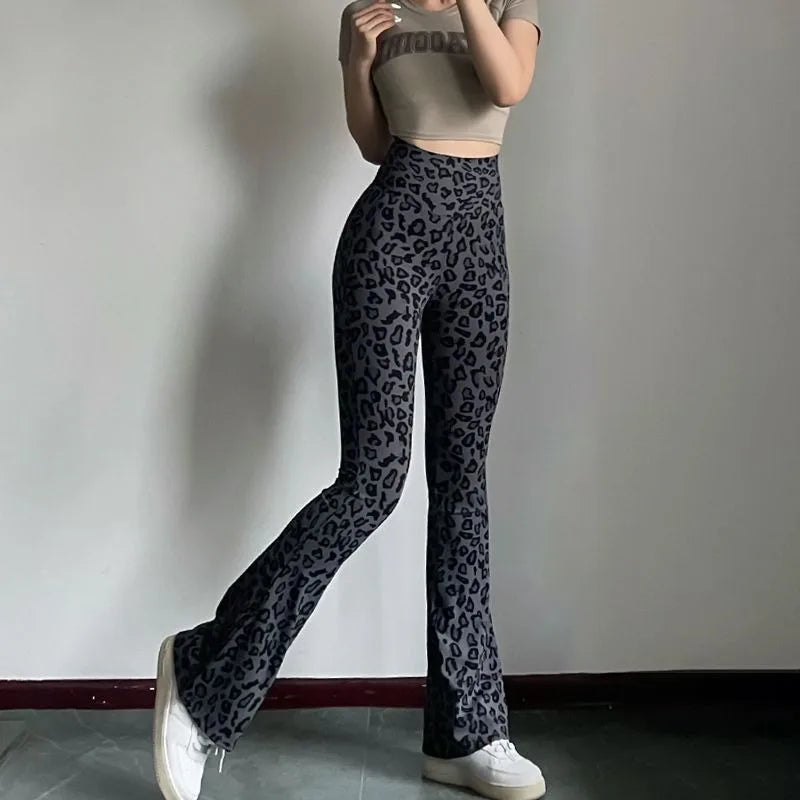 Leopard print yoga pants are breathable and make legs look longer. Slightly flared pants. High-waisted sports Pilates pants.