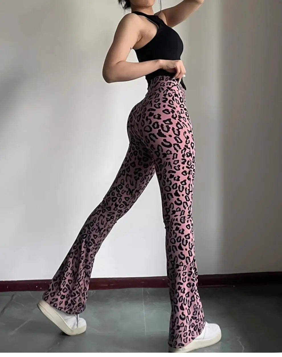 Leopard print yoga pants are breathable and make legs look longer. Slightly flared pants. High-waisted sports Pilates pants.