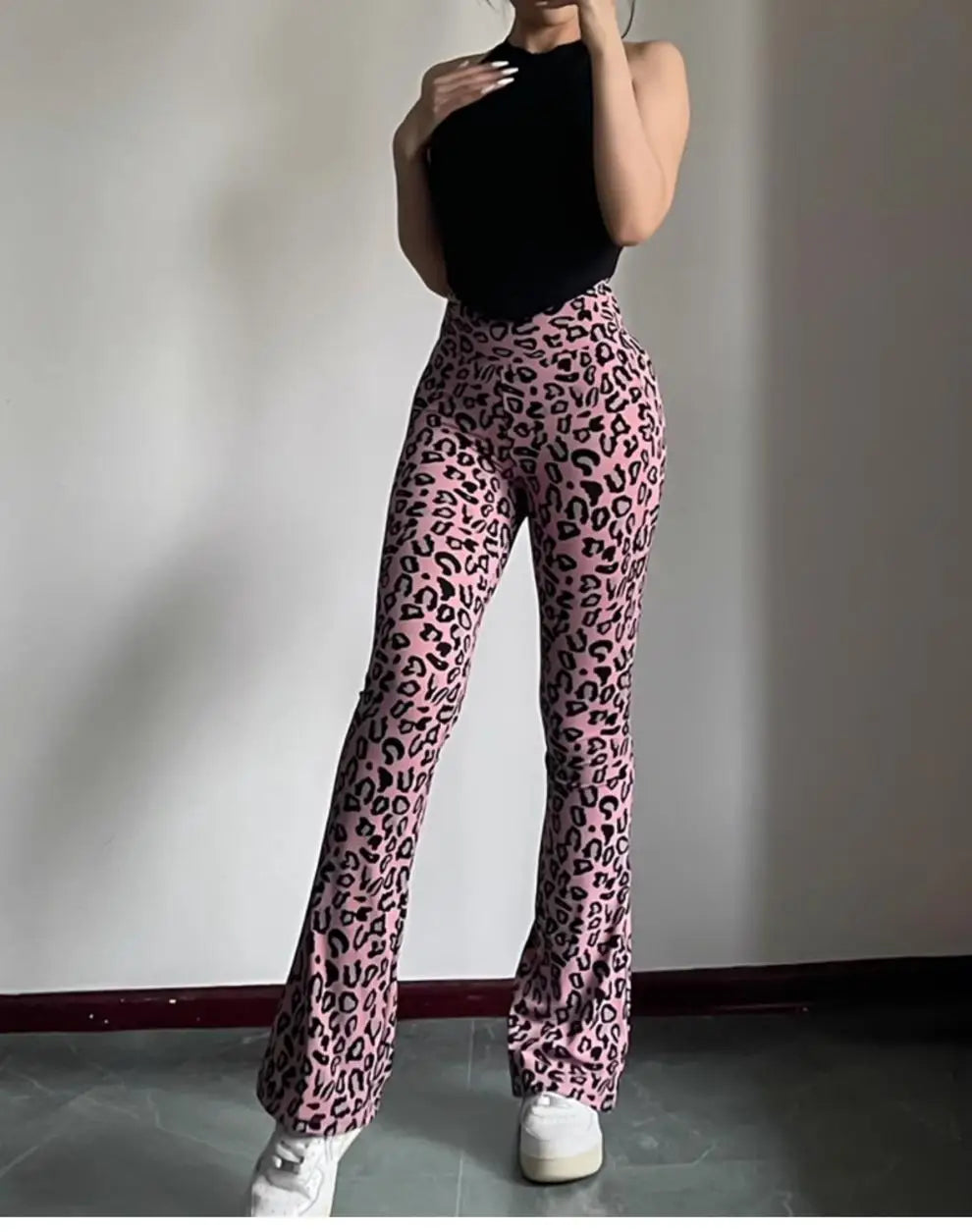 Leopard print yoga pants are breathable and make legs look longer. Slightly flared pants. High-waisted sports Pilates pants.